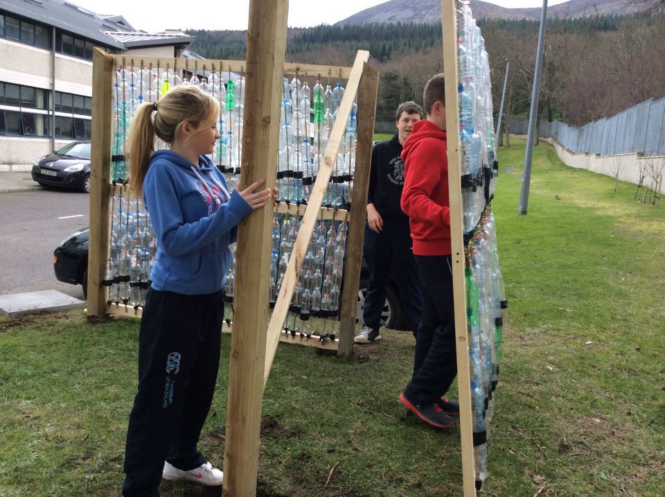 Students helping to build the greenhouse