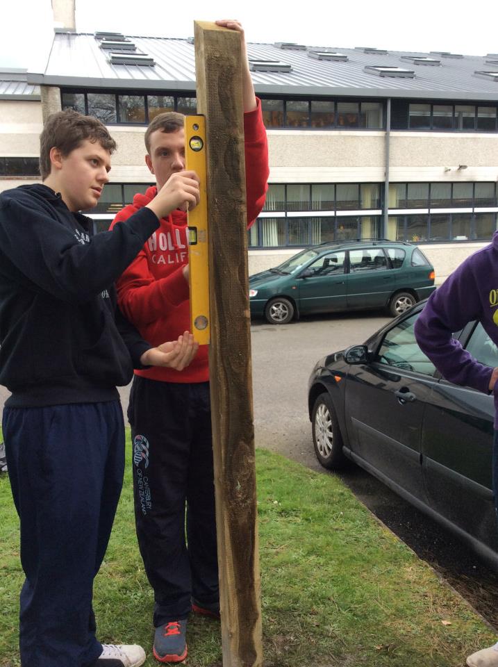 Students helping to build the greenhouse