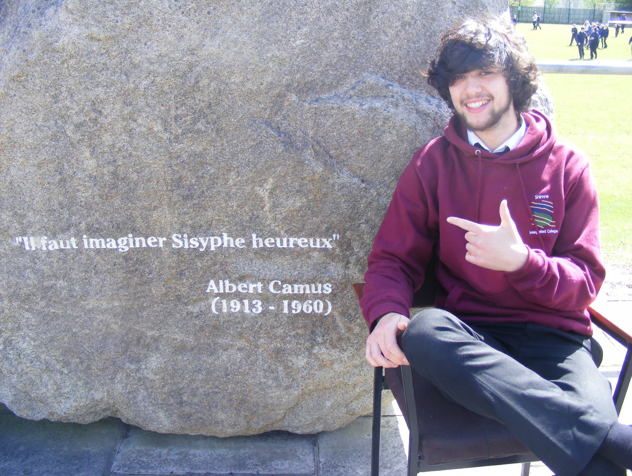 A picture of a student at the boulder